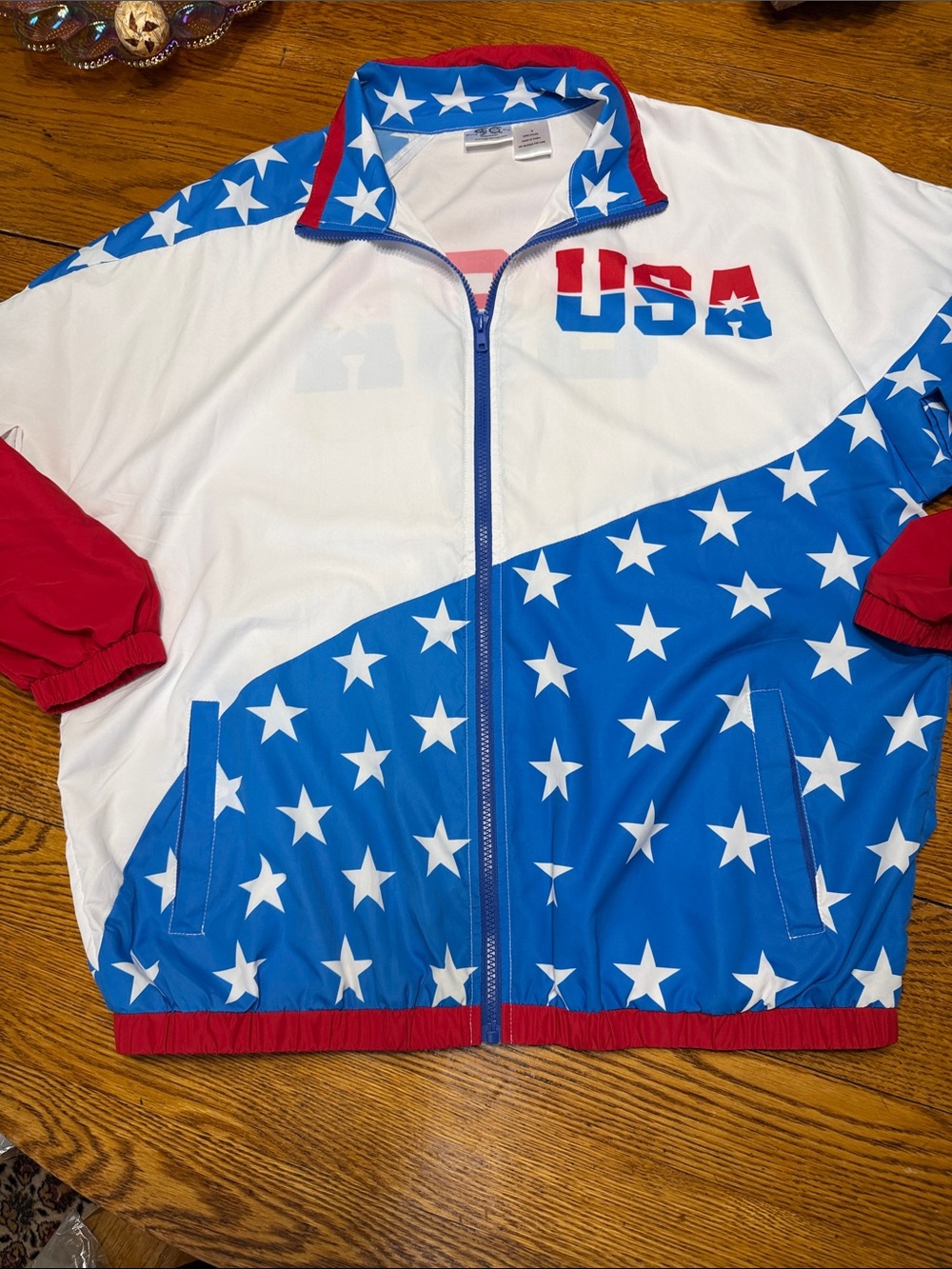 Funny Guy Mugs patriotic nylon windbreaker. Zip front, red white & blue. Medium